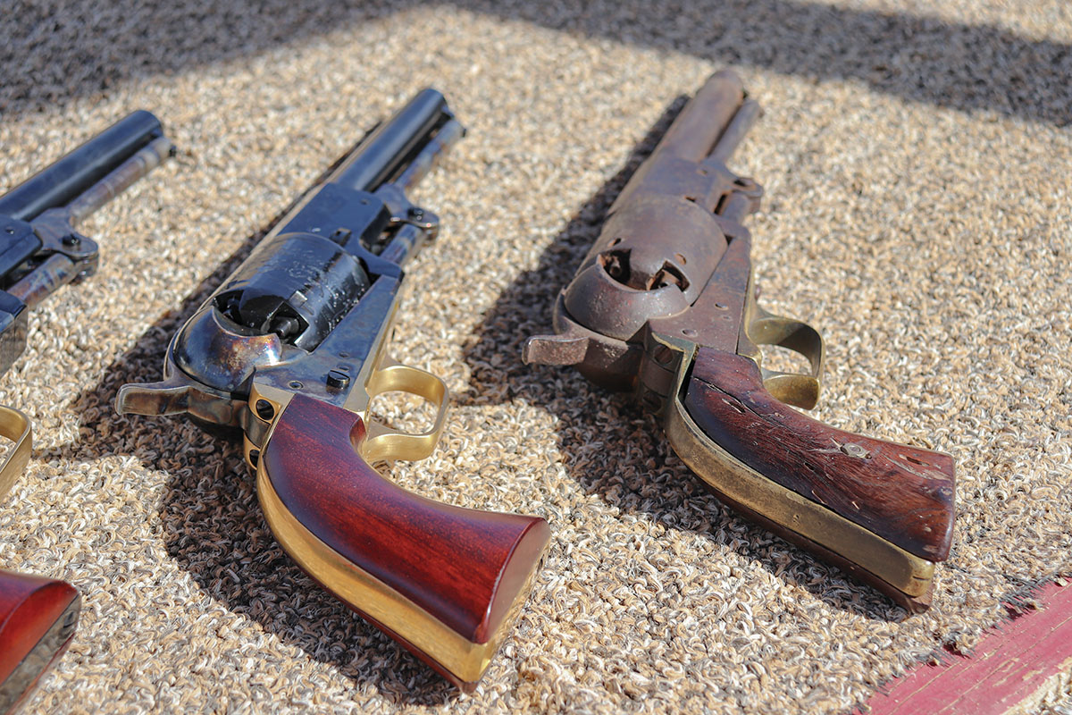 Grip contours are similar on this original Colt 1st Model (right) and the 3rd Model replica (left).